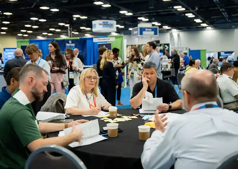 Industry professionals networking at TAPPICon 2026 exhibition and conference
