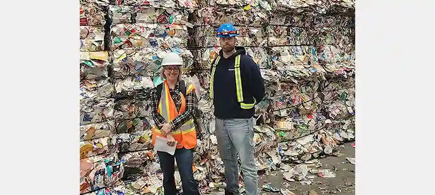 Isabelle Faucher stands in front of carton bales with Marc-André Lavoie of Société VIA, at the Lachine MRF in Montréal